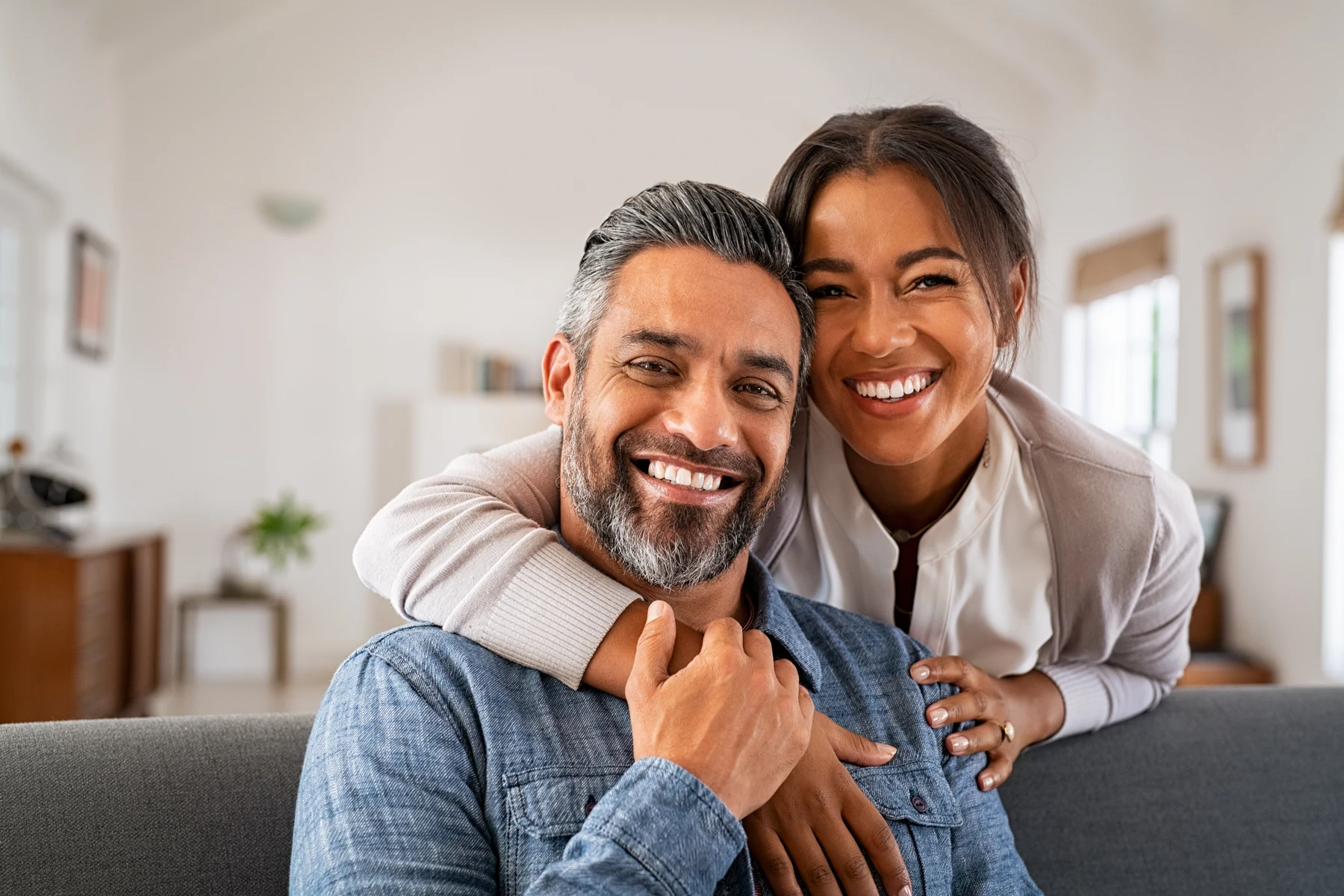 Couple smiling together at home